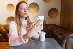 teenage girl enjoying mobile videos